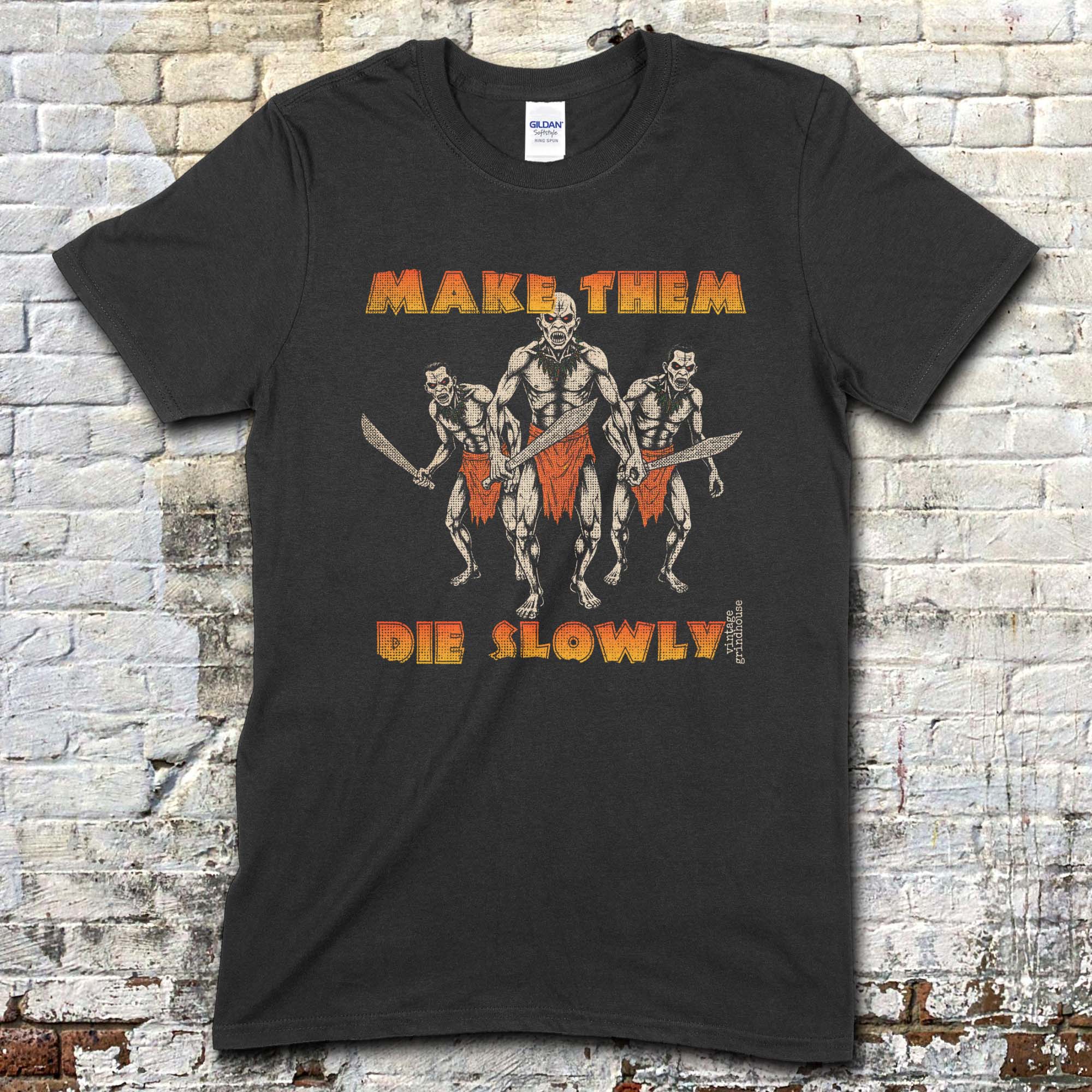 Black t-shirt featuring three savage tribal warriors with blades and Make Them Die Slowly text in orange on front