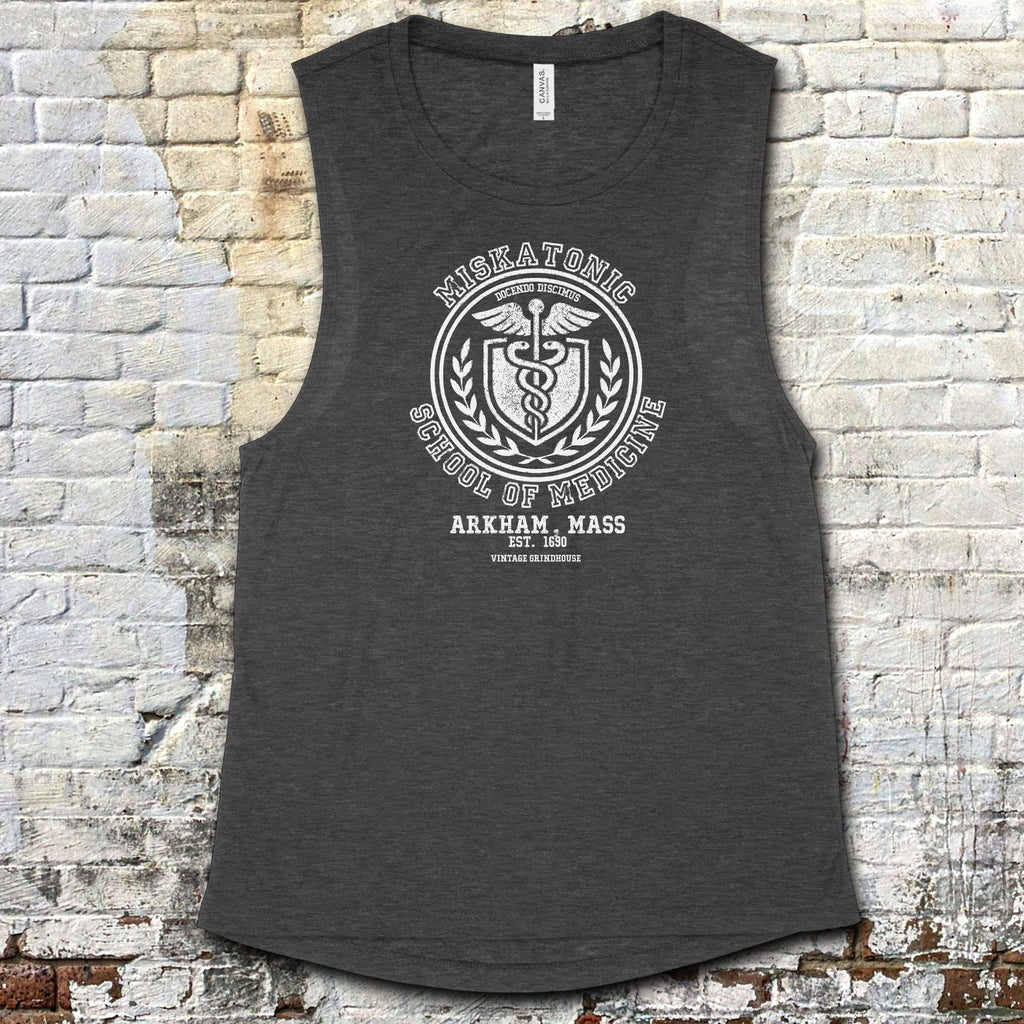 Miskatonic School of Medicine muscle tank with vintage medical emblem and Arkham, Mass text on dark heather fabric