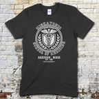 Black t-shirt featuring a vintage medical crest graphic with Miskatonic School of Medicine and Arkham, Mass text on front