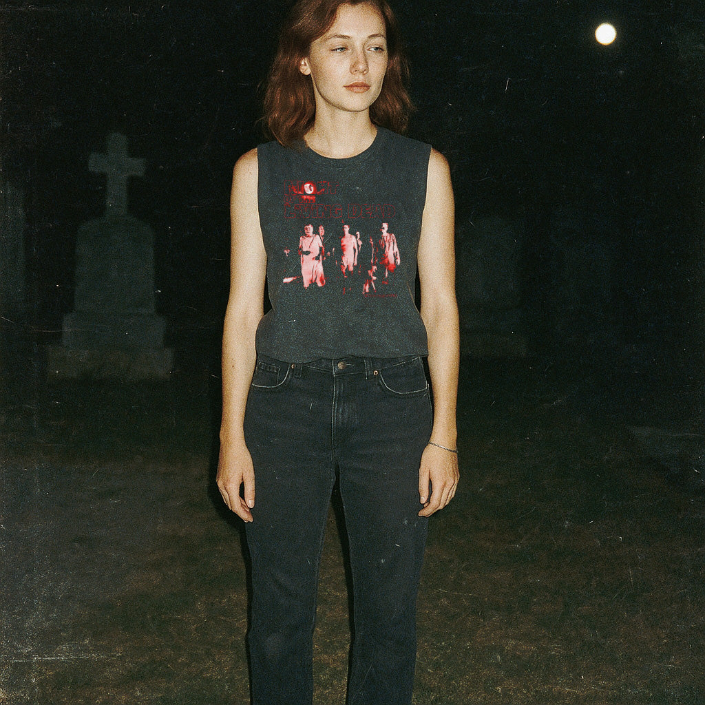 Night of the Living Dead design #2 muscle tank showing zombie figures in eerie red tones on dark fabric worn outdoors at night