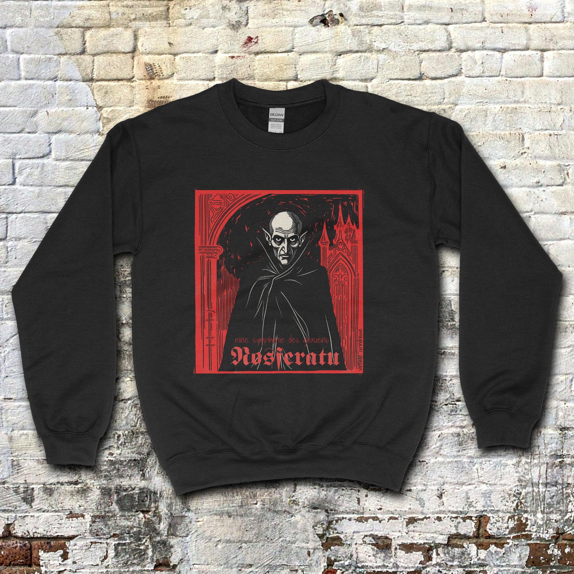 Nosferatu: A Symphony of Horror sweatshirt with bold red and black graphic of classic vampire against gothic backdrop
