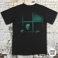 Black shirt featuring eerie greenish Nosferatu figure behind window bars with title Nosferatu: A Symphony of Horror in vintage style