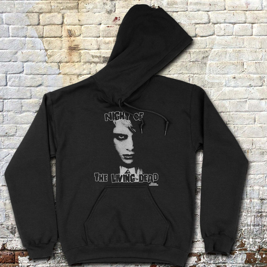 Night of the Living Dead hoodie featuring a black and white zombie face with distressed horror text on black fabric background