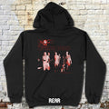 Black hoodie with 'The Walking Dead' graphic on a brick wall background