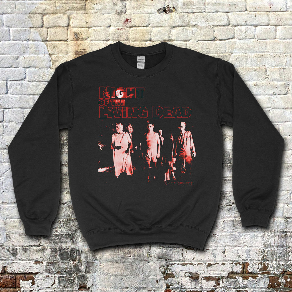 Black sweatshirt featuring red horror movie graphic and text with a group of undead figures on Night of the Living Dead sweatshirt
