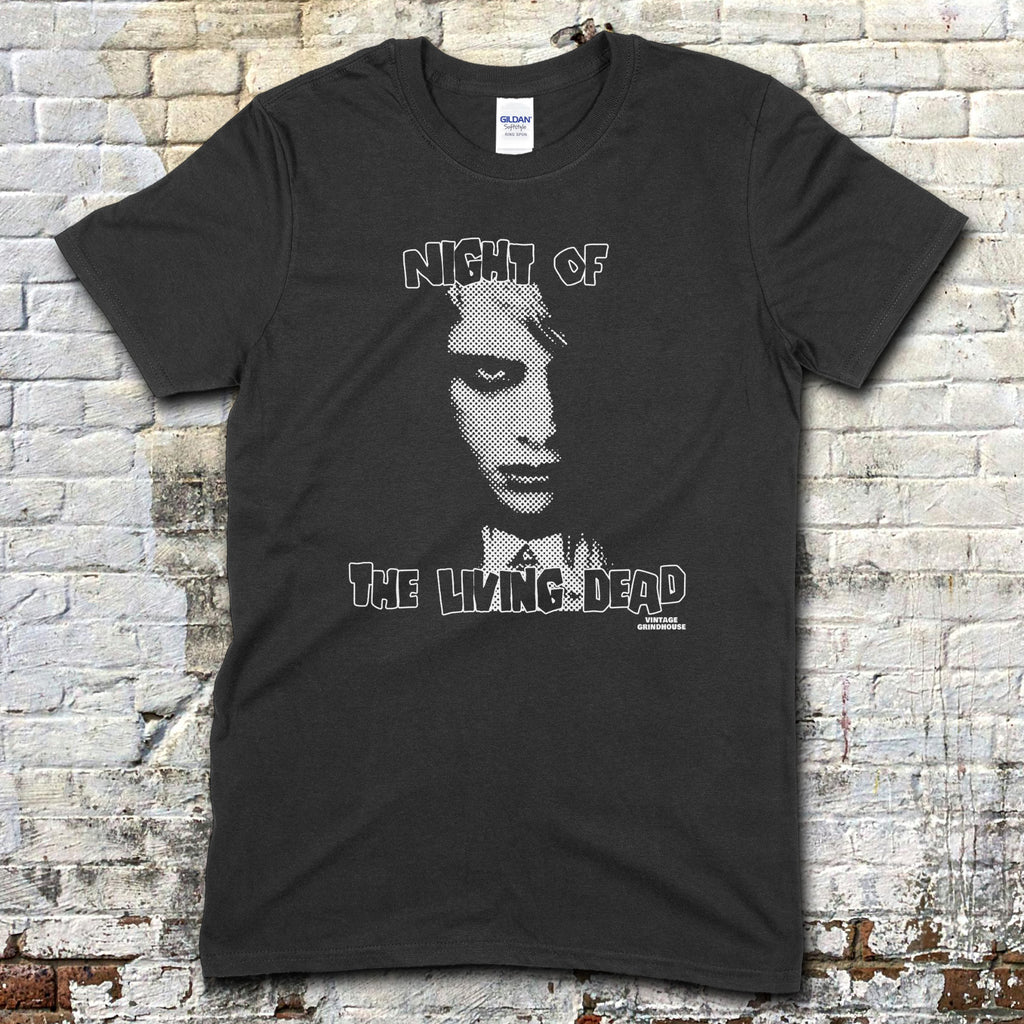 Black t-shirt featuring a stylized monochrome graphic of a zombie face with Night of the Living Dead text on front