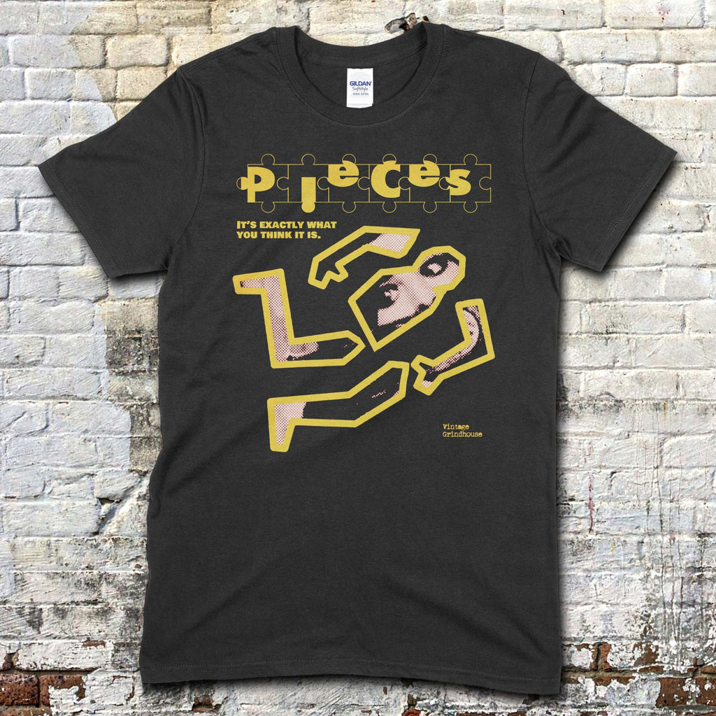 Black t-shirt featuring a yellow puzzle piece graphic forming a crime scene outline with text Pieces Crime Scene Edition on front