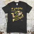 Black t-shirt featuring a yellow puzzle piece graphic forming a crime scene outline with text Pieces Crime Scene Edition on front
