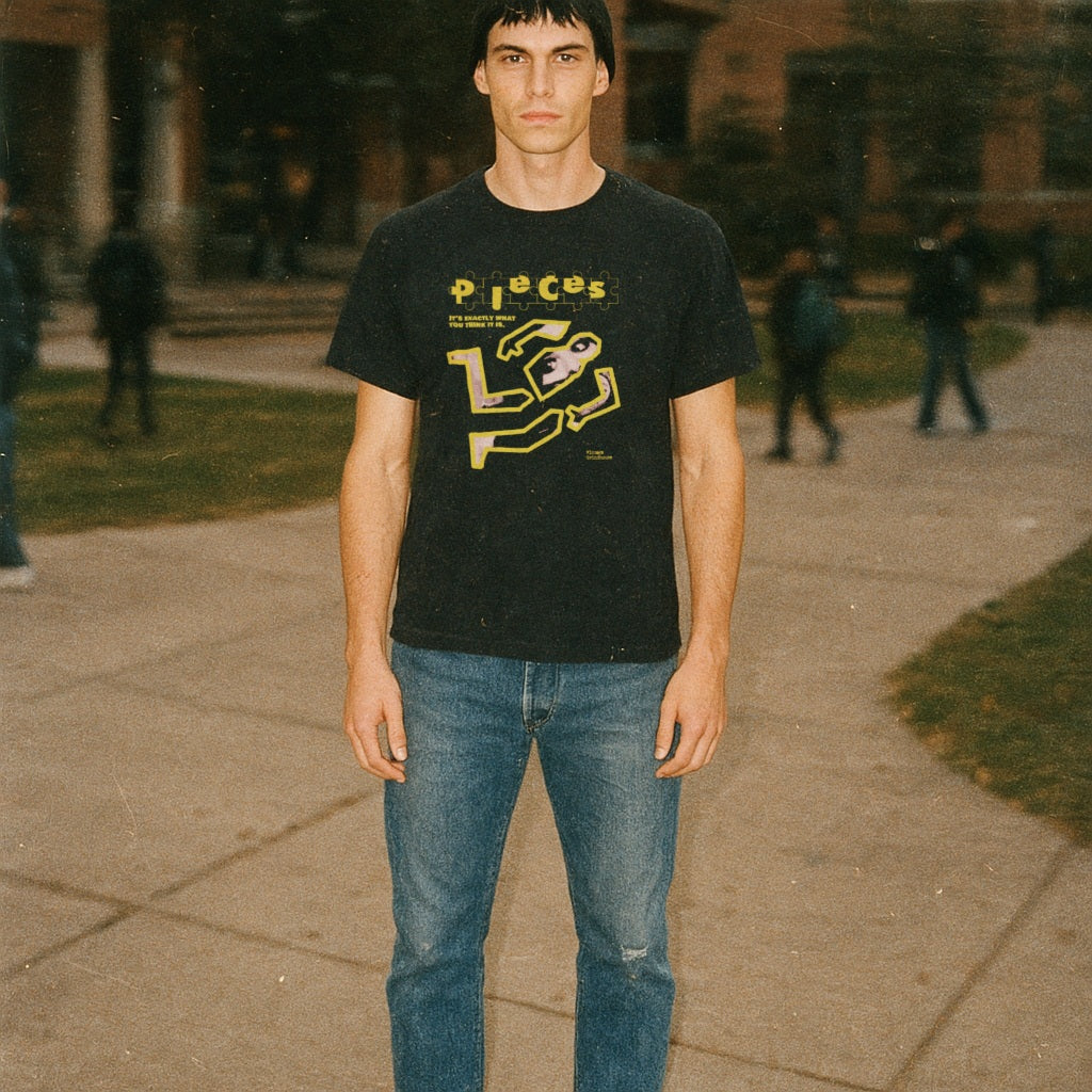 Pieces - Crime Scene Edition sweatshirt with yellow crime scene outline and graphic worn by standing male model outdoors