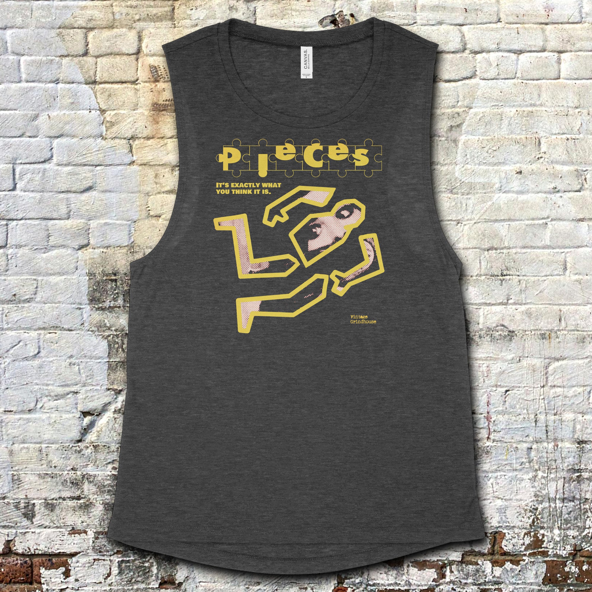 Pieces muscle tank - Crime Scene Edition featuring puzzle piece text and chalk outline of body with photo detail on dark fabric