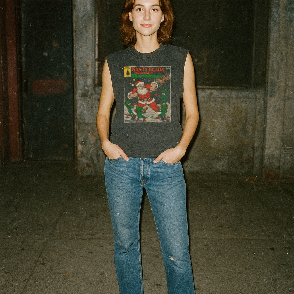 Woman wearing Santa Claus Conquers the Martians muscle tank with vintage Santa and alien combat illustration