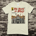 Beige t-shirt featuring a vintage comic cover graphic of five female bikers riding motorcycles in the desert on front