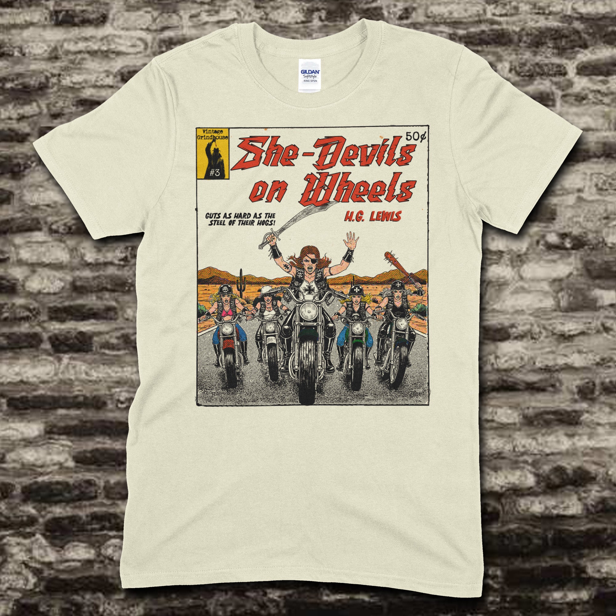Beige t-shirt featuring a vintage comic cover graphic of five female bikers riding motorcycles in the desert on front