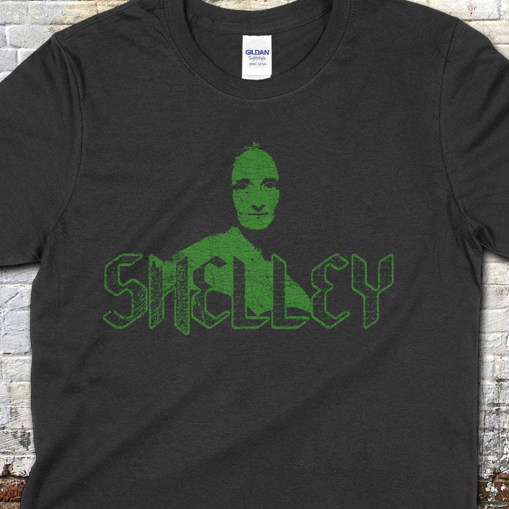 Mary Shelley t-shirt in black with stylized green gothic font and a subtle portrait design on the front