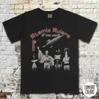Atomic Rulers of the World t-shirt featuring vintage sci-fi characters and a spaceship in retro grindhouse style design.