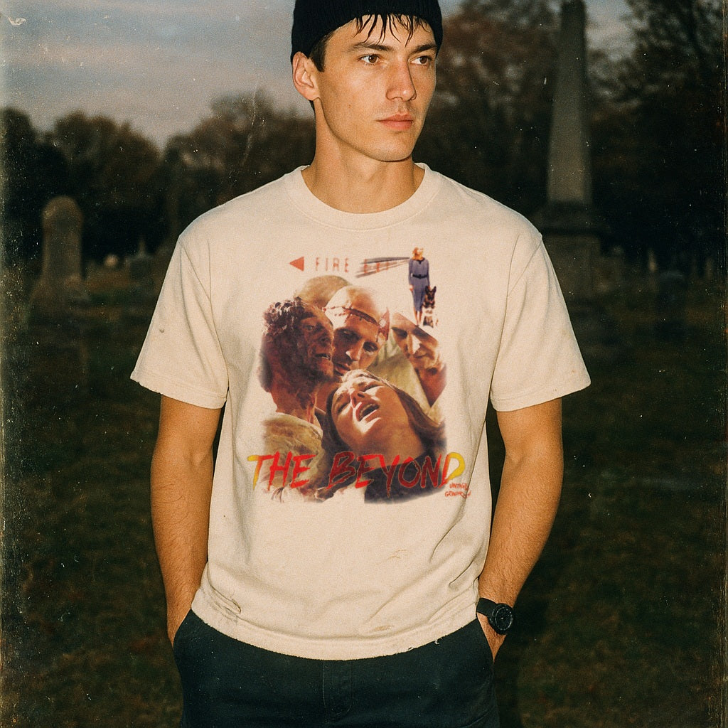 Person wearing a t-shirt with a graphic design in a cemetery