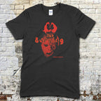 Black t-shirt featuring a red graphic of a masked face and The Burning text in a vintage style on front