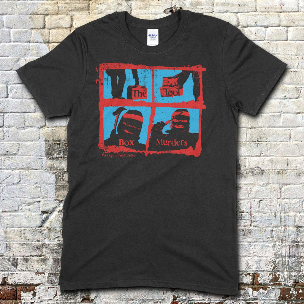 Black t-shirt featuring a red and blue graphic grid with masked figures and text The Toolbox Murders on front