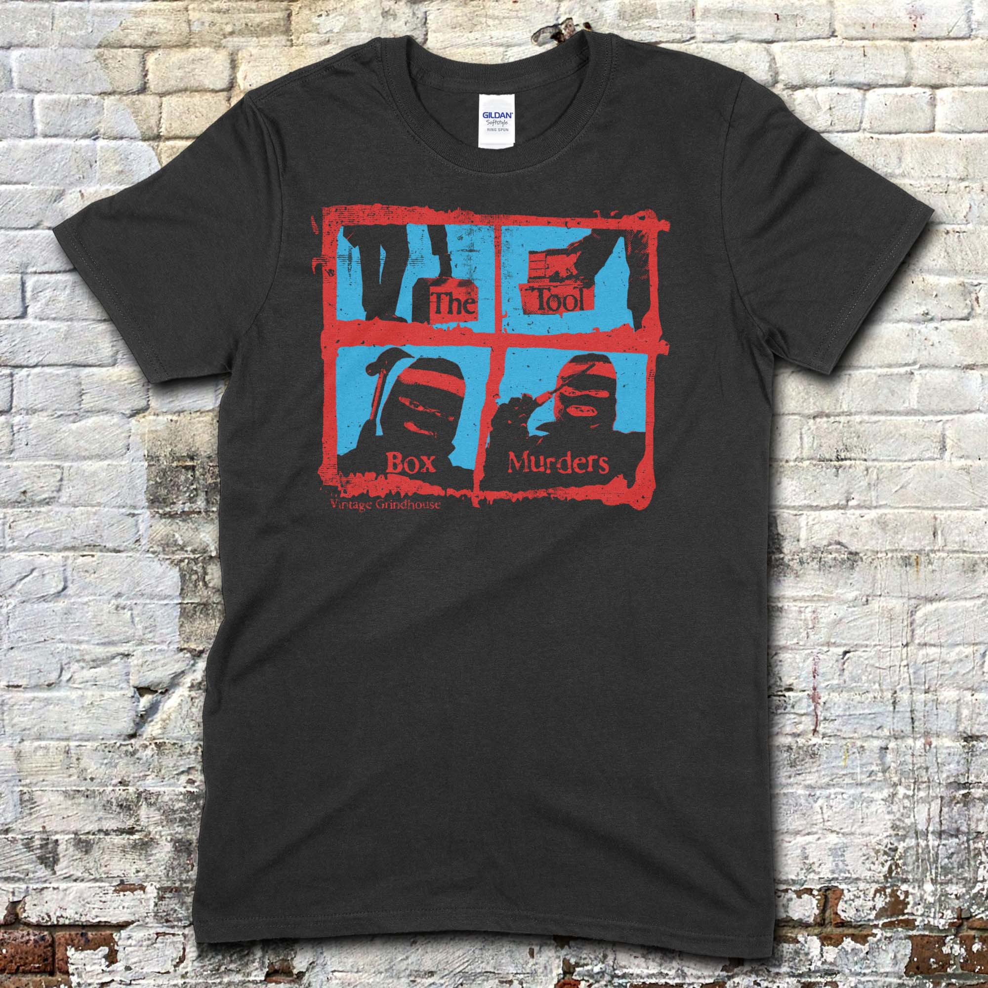 Black t-shirt featuring a red and blue graphic grid with masked figures and text The Toolbox Murders on front