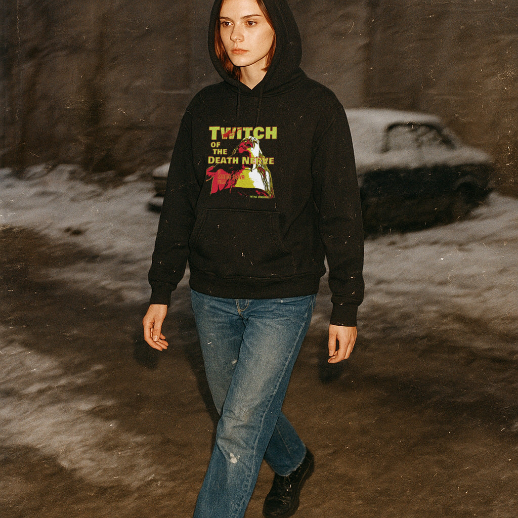 Person wearing a black hoodie with a graphic design, standing in a snowy landscape.