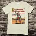 Beige t-shirt featuring a comic book cover style graphic of Warriors of the Wasteland with a post-apocalyptic warrior and cars.