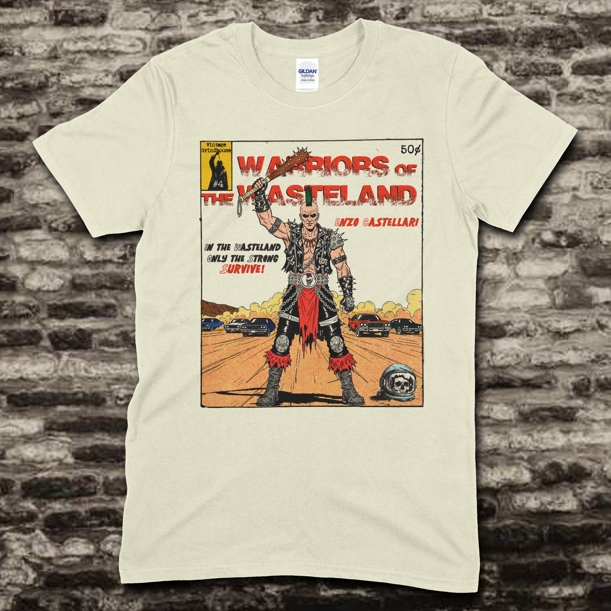 Beige t-shirt featuring a comic book cover style graphic of Warriors of the Wasteland with a post-apocalyptic warrior and cars.