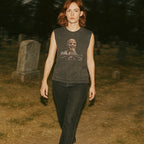 Zombi 2 muscle tank with graphic of decayed skull rising from graveyard on faded black fabric