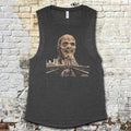 Zombi 2 muscle tank featuring decayed zombie head graphic above city skyline on dark gray fabric