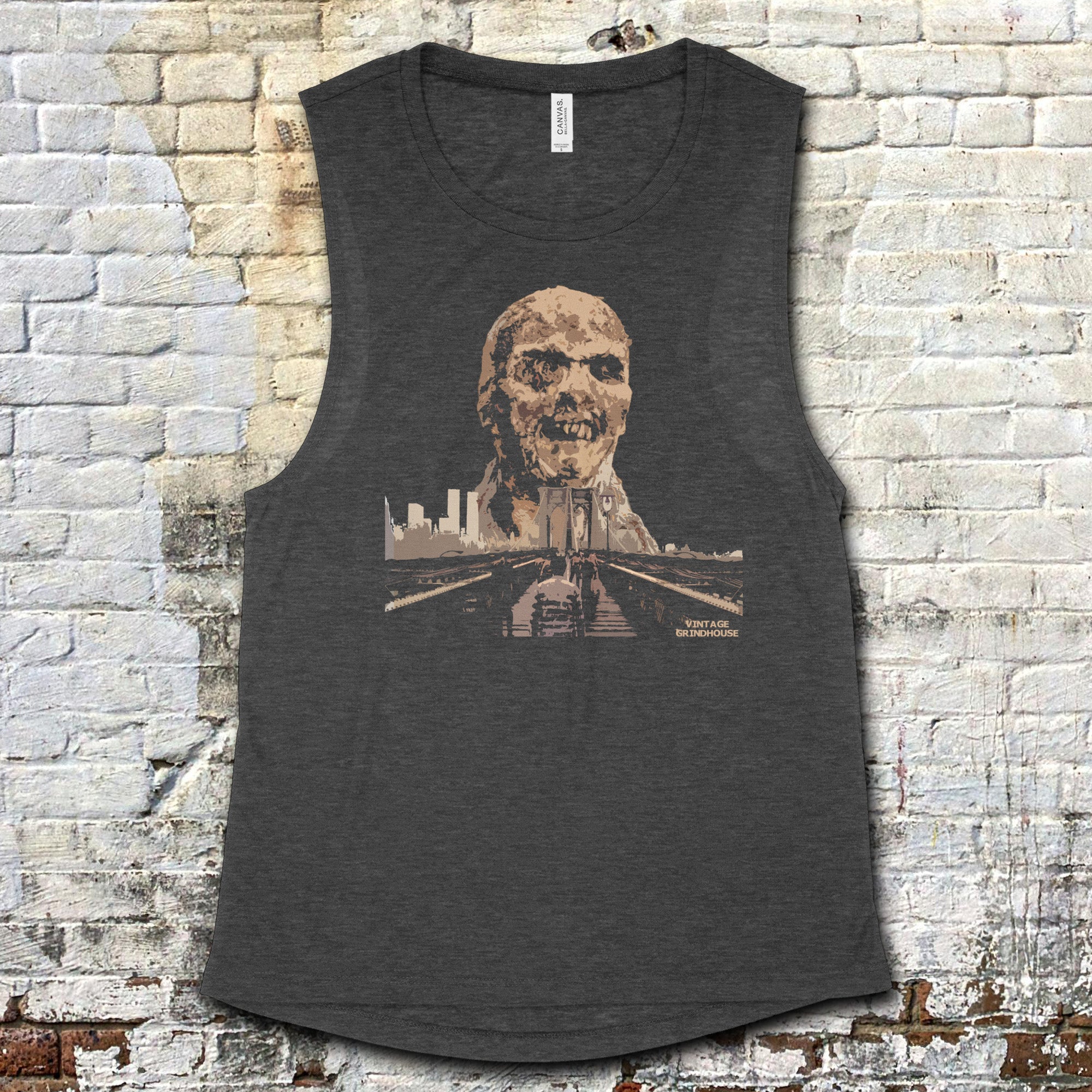 Zombi 2 muscle tank featuring decayed zombie head graphic above city skyline on dark gray fabric
